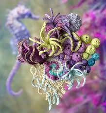 Fiber art sculpture with three-dimensional textile elements
